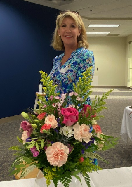 women with floral arrangement