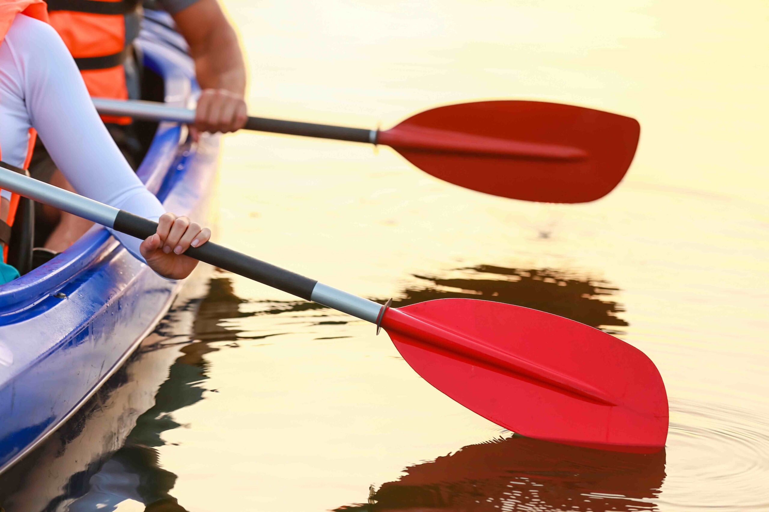 Two hands with kayaks