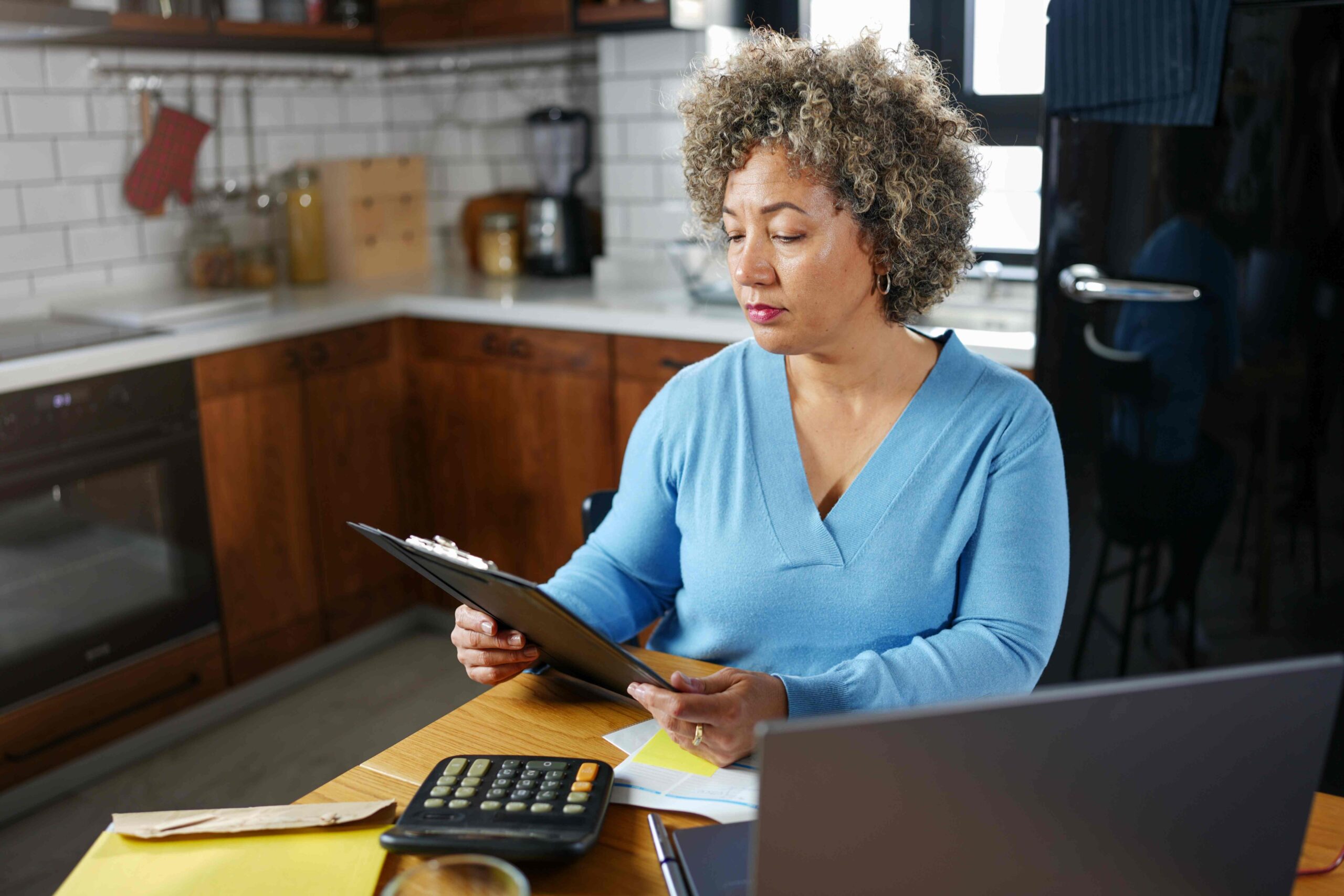 woman looking over finances