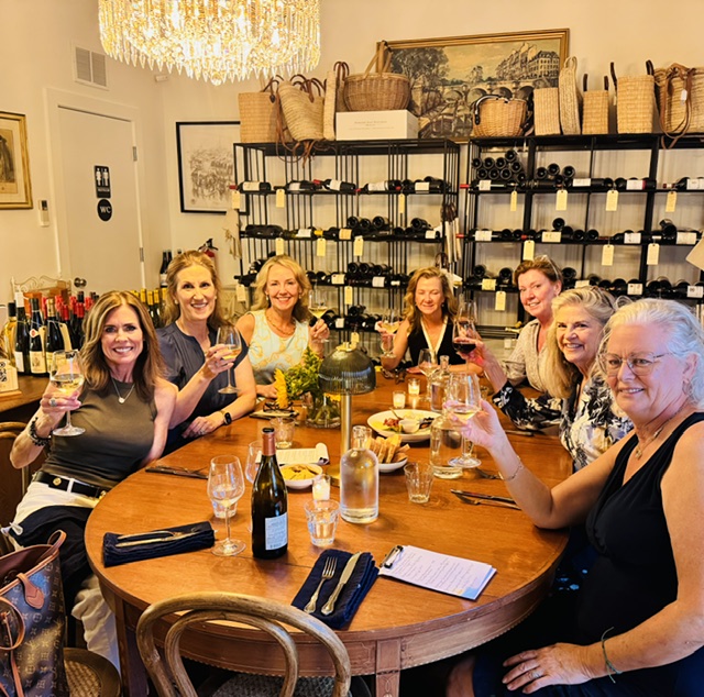 Women enjoying wine at a French restaurant