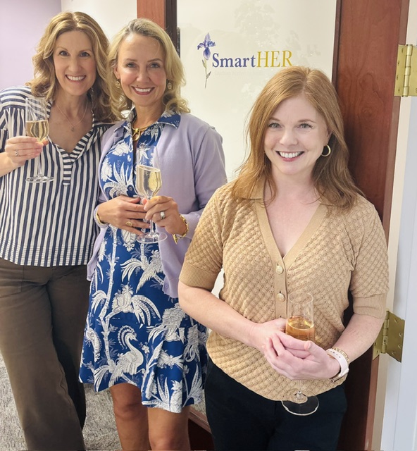 Talley, Jennifer and Stacey standing in front of new office space